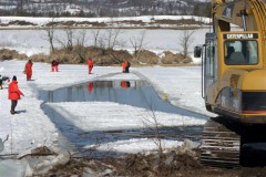 cutting ice floes to search for underwater UXO