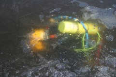 diver under the lake ice