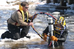 assisting diver with hoses and magnetometer