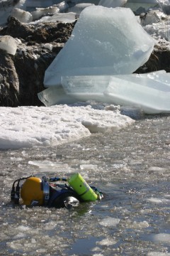 diving in icy lake seeking underwater UXO