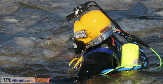 diver in icy water searching for underwater UXO