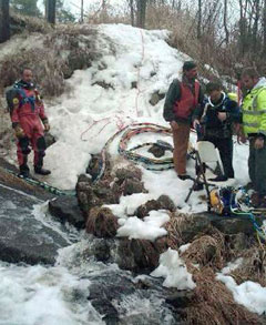 divers preparing to search icy stream