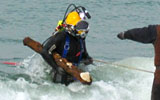 hauling underwater UXO from the surf