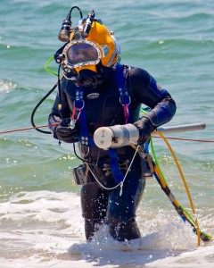 UXO diver with magnetometer in patented HeckHousing™