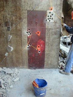 setting explosive charges in the Nike missile bay walls