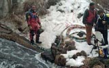 divers preparing to search icy stream