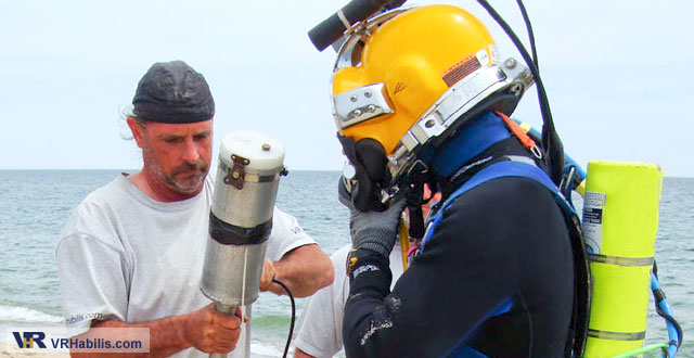 UXO diver preparing to use metal detector in HeckHousing (tm)