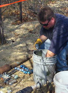 sorting grenades and other UXO as part of military range clearance